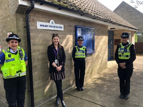Roisin stood under the sign for Spilsby Police Station, along with uniformed Lincolnshire Police officers