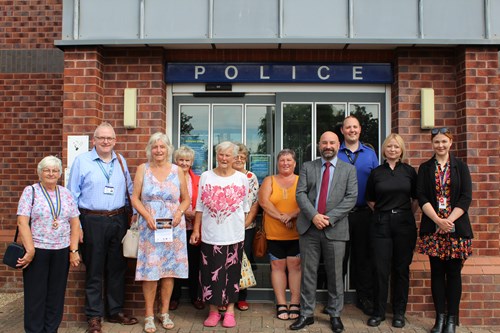 An image of PCC Marc Jones and Safer Together Coordinator Roisin Mullee stood in front of Mablethorpe Police Station with representatives from local community groups